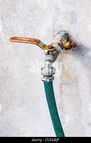 Water tap on the wall Stock Photo