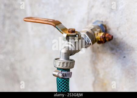Water tap on the wall Stock Photo
