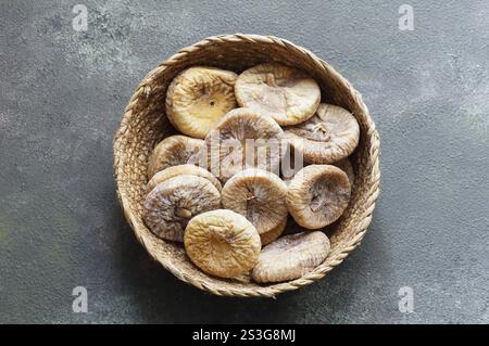 Sun dried figs on rustic table, organic tasty fruits, healthy dry fruit concept Stock Photo