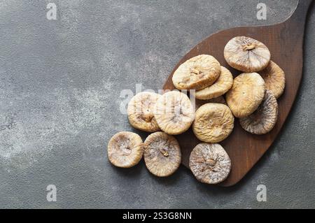 Sun dried figs on rustic table, organic tasty fruits, healthy dry fruit concept Stock Photo