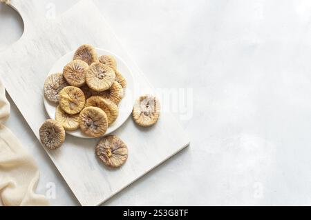 Sun dried figs on rustic table, organic tasty fruits, healthy dry fruit concept Stock Photo