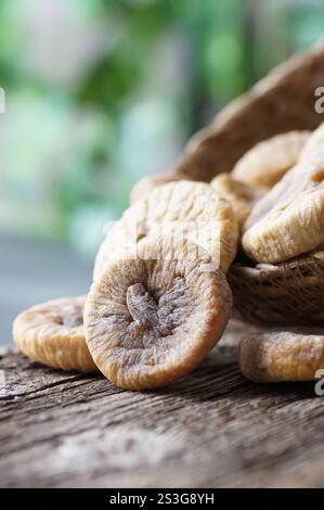 Sun dried figs on rustic table, organic tasty fruits, healthy dry fruit concept Stock Photo