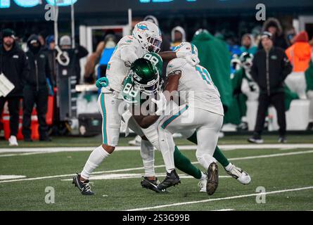 New York Jets tight end Kenny Yeboah (88) is tackled by Miami Dolphins linebacker Tyrel Dodson (11) and safety Elijah Campbell (22) during a NFL game at MetLife Stadium in East Rutherford, New Jersey. Duncan Williams/CSM (Credit Image: © Duncan Williams/Cal Sport Media) Stock Photo