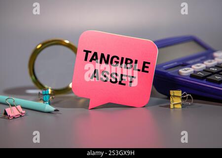 Tangible Asset text written on a notebook with pencils Stock Photo