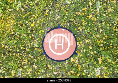 Small round landing pad for a copter from above Stock Photo