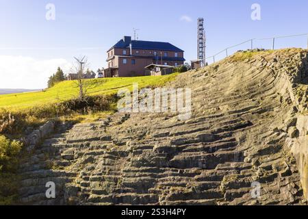 Basalt outcrop from a former quarry on the Hirstsein with mining hut, Erzgebirge, Marienberg Saxony, Germany, Europe Stock Photo