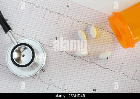 Electrocardiogram, ecg, ekg printed report graph with medication and stethoscope Stock Photo