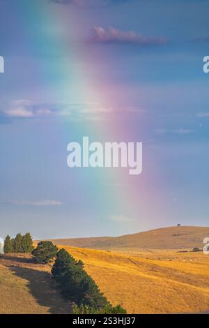 Rainbow over the countryside at Blayney in the Central West of NSW, Australia. Stock Photo