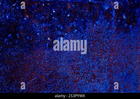 Textured artwork featuring a vibrant blue and red color palette, evoking creativity and depth. Perfect for backgrounds, inspiration, and showcasing ab Stock Photo