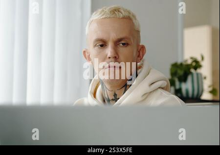 Young Man Working On Laptop Stock Photo