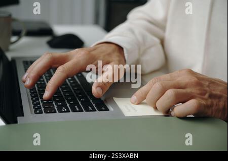 Programmer Typing Password On Laptop Stock Photo