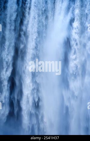 Majestic blue waterfall cascade flowing in abstract texture background Stock Photo