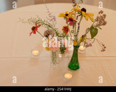 Whimsical summer wedding reception table decor Stock Photo
