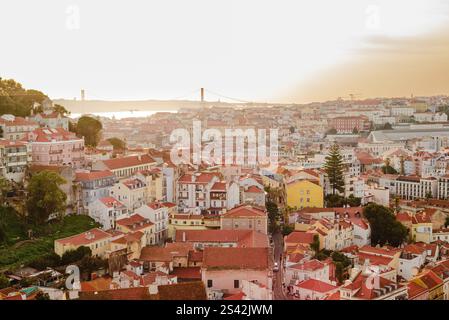 Sunset Over Lisbon's Rooftops and River View Stock Photo