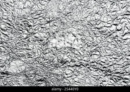 crumpled aluminum foil background or overlay Stock Photo