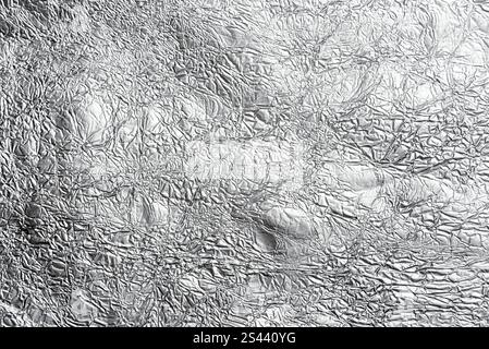 crumpled aluminum foil background or overlay Stock Photo