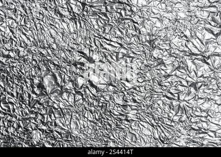 crumpled aluminum foil background or overlay Stock Photo