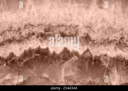 Mocha-mousse colored stone texture with intricate patterns and layers. Pantone's 2025 color of the year Stock Photo