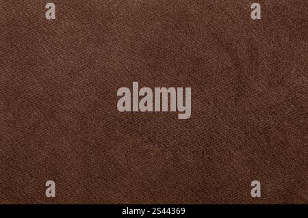 Brown velour fabric texture with subtle details, representing Pantone's Mocha Mousse. Stock Photo