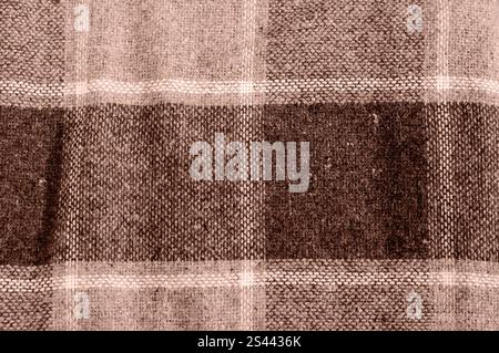 Soft plaid fabric texture in mocha-mousse shades, detailed woven fibers. Stock Photo