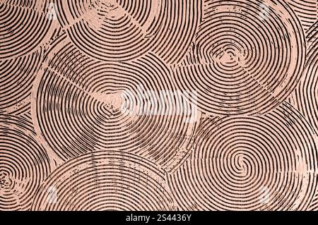 Intricate spiral and circle patterns in mocha-mousse plaster, perfect for accent wall decor. Stock Photo