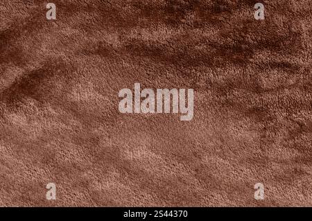 Soft fabric texture in a rich mocha-mousse tone, smooth and plush surface. Stock Photo
