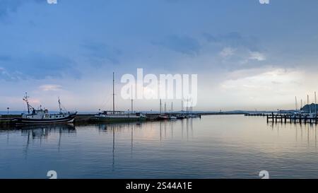 Sassnitz, Mecklenburg-Vorpommern, Germany - 26 June 2022: View of the town harbor of Sassnitz on the island of Rügen at dusk. Stock Photo