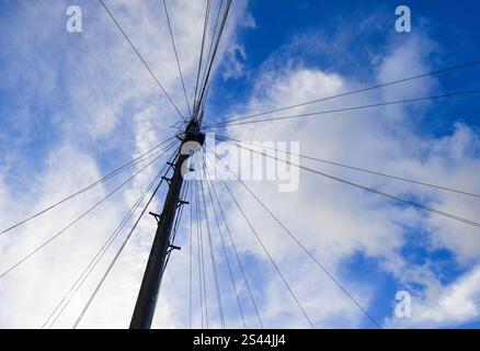 Looking up at BT Open Reach Telegraph Pole and telephone cables with sky behind in Brighton UK : Stock Photo