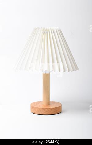 Bedside lamp with warm light. Table lamp. Lamp for reading books in bed. Isolated on white background Stock Photo