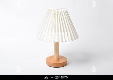 Bedside lamp with warm light. Table lamp. Lamp for reading books in bed. Isolated on white background Stock Photo
