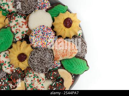 Christmas cookies assorted shortbread partial plate snacks white background copy space. Stock Photo
