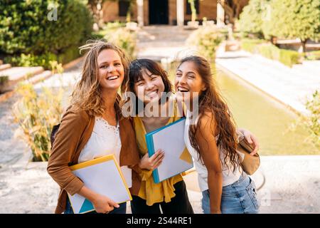 University exchange students laughing together on campus Stock Photo