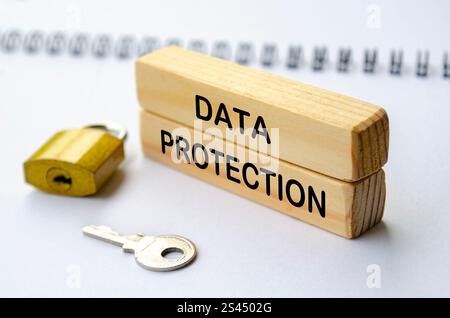 Data Protection text on wooden blocks. Cybersecurity concept. Stock Photo