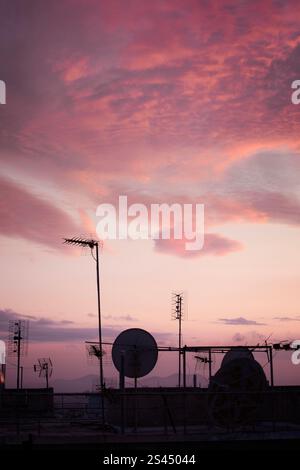 A dense array of communications and broadcast antennas dominates the rooftops of Athens, Greece, creating an intricate skyline. Stock Photo