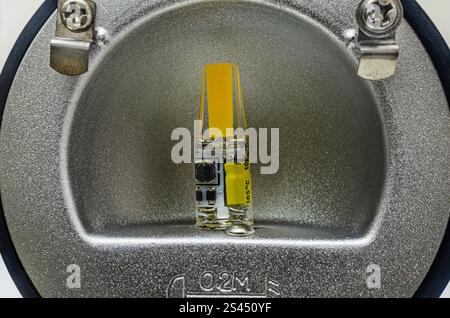 Close-up of an LED Bulb in a Reflector Housing. Close-up of a small LED light bulb mounted in a round reflector housing. Stock Photo