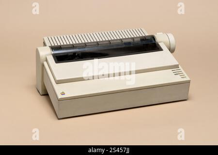 Pavia, Lombardy, Italy - November 2, 2024: Apple dot matrix printer ImageWriter II, from 1985, at Ctrl+Alt Museum. 4 color printer. Speed: 2-6 page pe Stock Photo