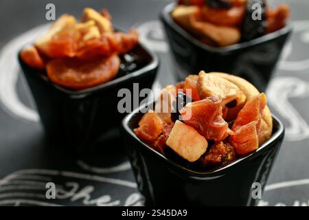 Dried fruits in ceramic pot, healthy food Stock Photo