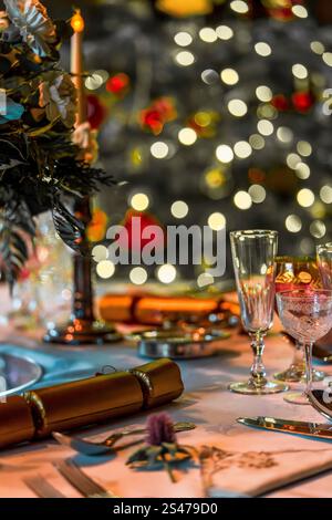 Elegant Holiday Season Table Setting with Festive Decorations and Bokeh Lights (Warm Colours) Stock Photo