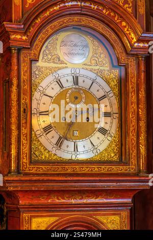 Close-Up of a Vintage Grandfather Clock with Intricate Details Stock Photo
