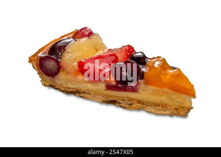 Slice of cheesecake covered with pieces of fresh and candied fruit. Isolated on white with clipping path Stock Photo