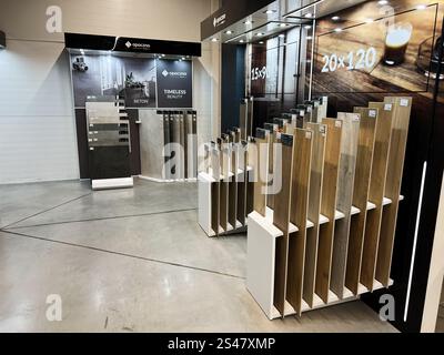 Kyiv, Ukraine - January 10, 2025: Bright and organized tile showroom featuring a range of floor and wall samples displayed for selection. The space hi Stock Photo