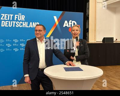 Riesa, Germany. 10th Jan, 2025. AfD leaders Tino Chrupalla (l) and Alice Weidel greet journalists at a press reception on the evening before the start of the AfD party conference. Credit: Jörg Ratzsch/dpa/Alamy Live News Stock Photo