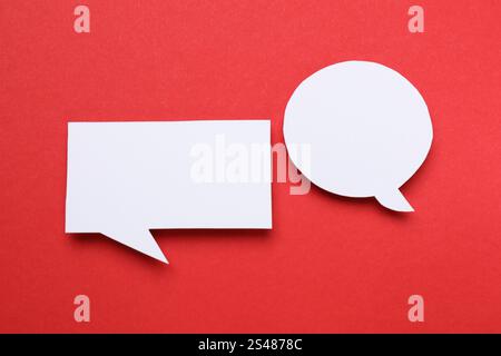 Blank speech bubbles on red background. Space for text Stock Photo