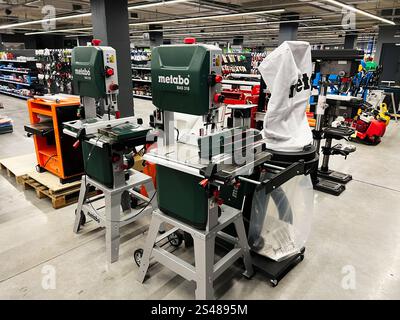 Kyiv, Ukraine - January 10, 2025: A selection of woodworking machines displayed in an industrial store environment, surrounded by supporting tools and Stock Photo