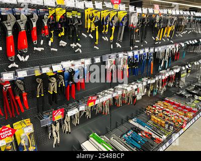 Kyiv, Ukraine - January 10, 2025: Several hardware hand tools neatly displayed on a store shelf with product labels and prices. Stock Photo