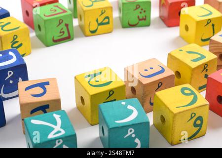 Wooden Arabic Alphabet Blocks isolated on white background. Arabic Alphabet Cubes. Preschool and education concept. Copy space Stock Photo