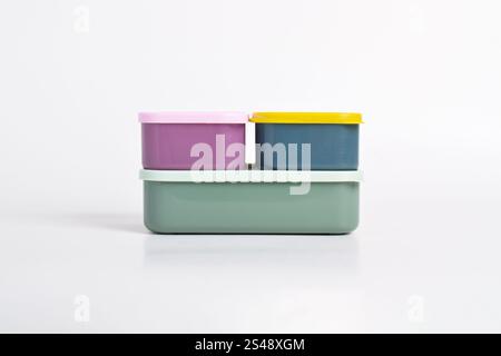 Three colorful Lunch Boxes isolated on white background. Plastic food containers Stock Photo