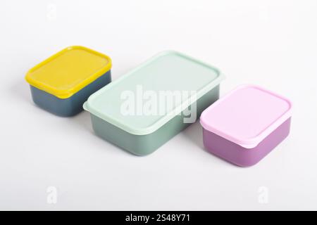 Three colorful Lunch Boxes isolated on white background. Plastic food containers Stock Photo