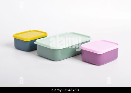 Three colorful Lunch Boxes isolated on white background. Plastic food containers Stock Photo
