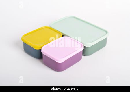Three colorful Lunch Boxes isolated on white background. Plastic food containers Stock Photo